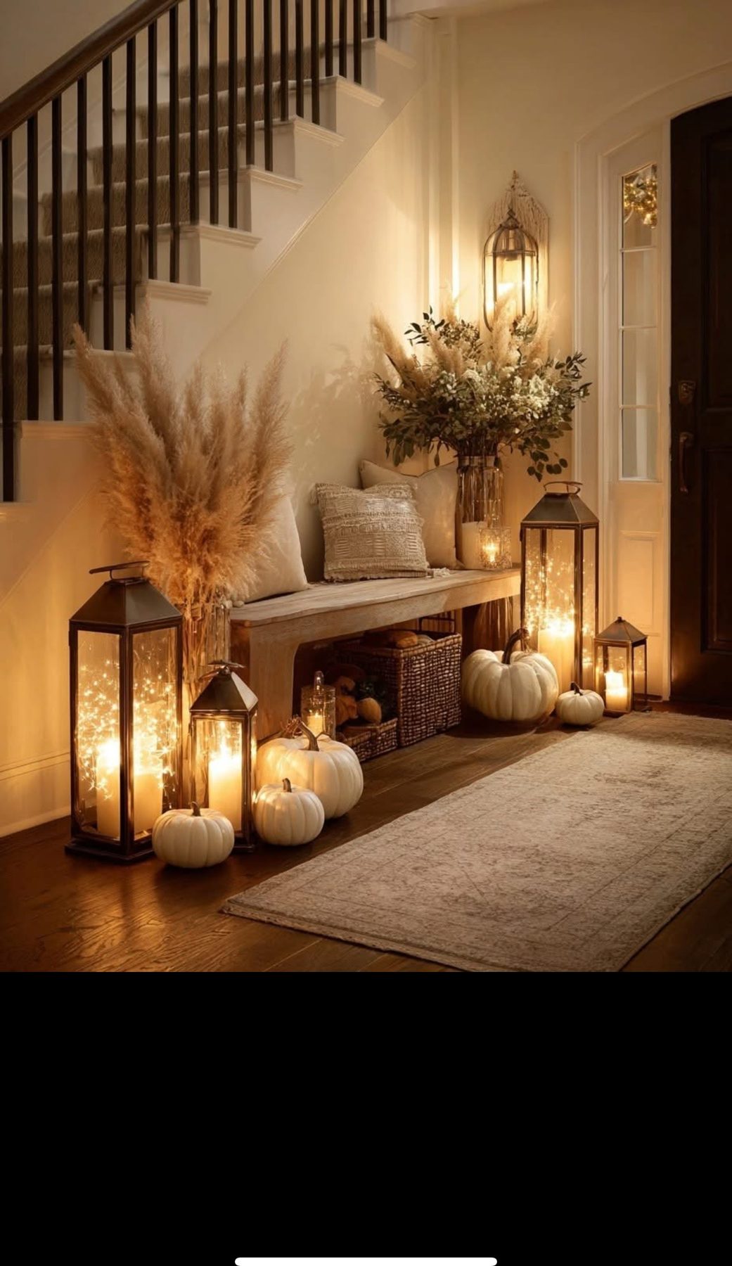 Cozy seasonal entryway styling with lanterns, pumpkins and pampas grass
